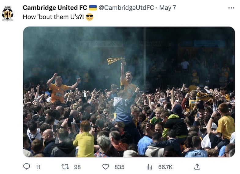 A tweet by Cambridge United with a picture of their players and fans celebrating staying in League One on the final day of the season.
